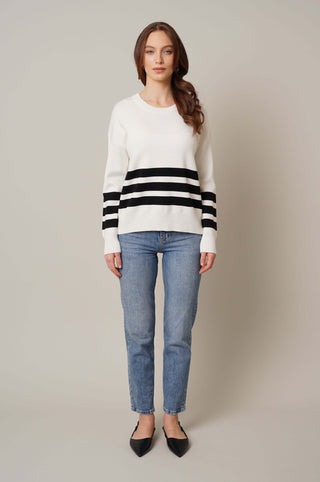 Model is wearing the striped crew neck pullover by Cyrus in Cream/Black