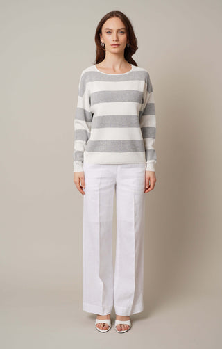 Model is wearing the striped waffle dolman by Cyrus in Light Heather Grey/Bone/Silver