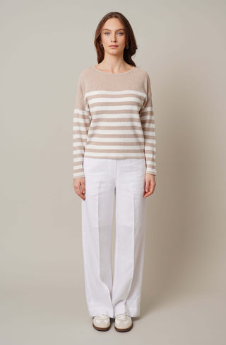 Model is wearing the striped dolman sweater by Cyrus in Oatmeal Cookie Heather/Bone