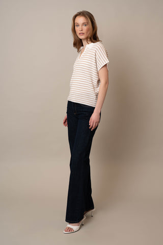 Model is wearing the Short Sleeve Dolman with Collar by Cyrus in Bone/Oatmeal Cookie Heather