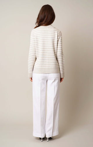 Model is wearing the split neck striped pullover by Cyrus in Kitten Heather/Cream