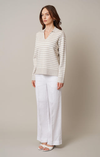 Model is wearing the split neck striped pullover by Cyrus in Kitten Heather/Cream