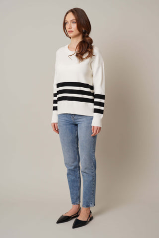 Model is wearing the striped crew neck pullover by Cyrus in Cream/Black