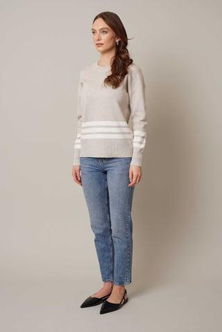Model is wearing the striped crew neck pullover by Cyrus in Kitten Heather/Cream