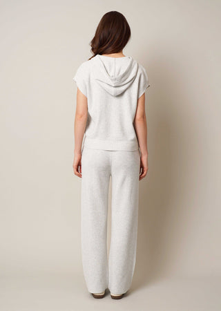 Model is wearing the sleeveless hoodie by Cyrus in Grey Goose Heather