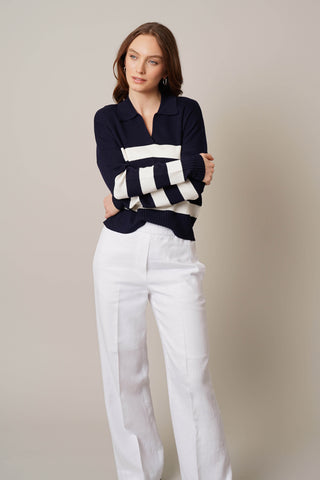 Model is wearing the striped split neck pullover by Cyrus in Eclipse/Cream
