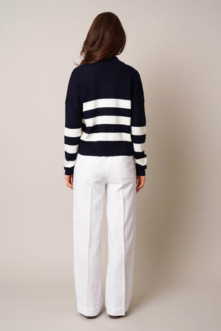 Model is wearing the striped split neck pullover by Cyrus in Eclipse/Cream