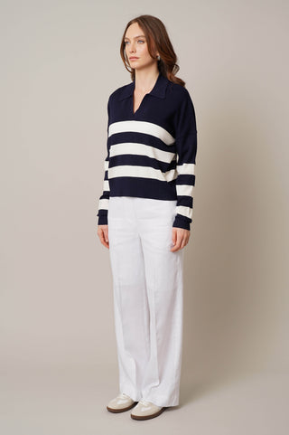 Model is wearing the striped split neck pullover by Cyrus in Eclipse/Cream