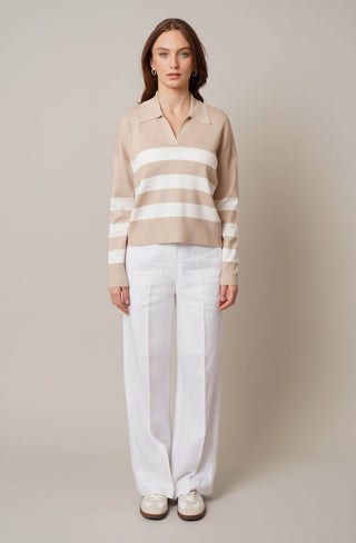 Model is wearing the striped split neck pullover by Cyrus in Oatmeal Cookie Heather/Cream