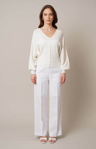 Model is wearing the v neck pullover cardigan by Cyrus in Cream