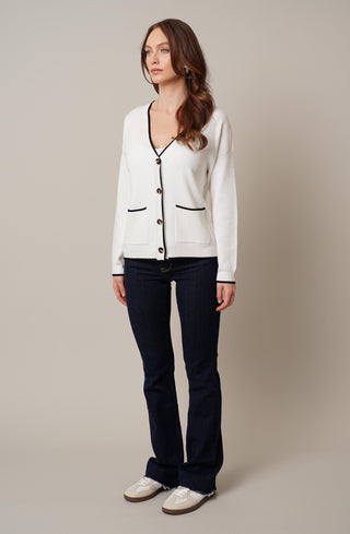 Model is wearing the v neck cardigan with tipping by Cyrus in Bone/Black