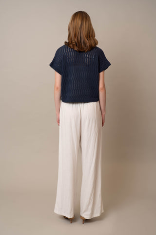 Model is wearing the Short Sleeve Dolman with Collar by Cyrus in Eclipse