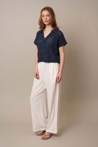 Model is wearing the Short Sleeve Dolman with Collar by Cyrus in Eclipse