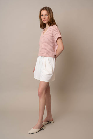 Model is wearing the Short Sleeve Dolman with Collar by Cyrus in Soft Blush