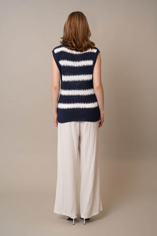 Model is wearing the Striped Pullover Vest by Cyrus in Eclipse/Bone