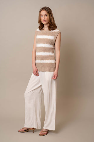 Model is wearing the Striped Pullover Vest by Cyrus in Oatmeal Cookie/Bone