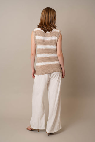 Model is wearing the Striped Pullover Vest by Cyrus in Oatmeal Cookie/Bone