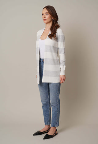 Model is wearing the striped waffle cardigan by Cyrus in Bone/Silver Heather Grey