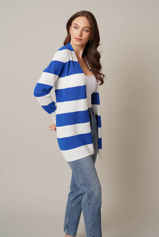 Model is wearing the striped waffle cardigan by Cyrus in Bone/Victoria Blue