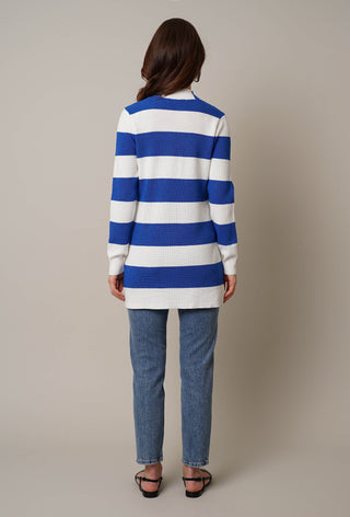 Model is wearing the striped waffle cardigan by Cyrus in Bone/Victoria Blue