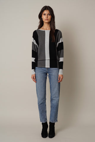 Light grey charcoal sweater with bold stripes and flattering sleeves.
