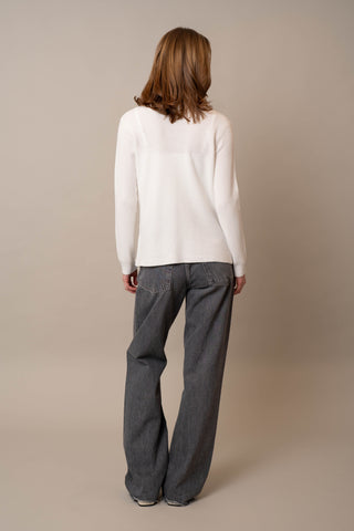 Model is wearing the Waffle Cardigan with Pockets by Cyrus in White