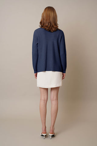 Model is wearing the Waffle Cardigan with Pockets by Cyrus in Eclipse