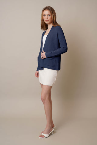 Model is wearing the Waffle Cardigan with Pockets by Cyrus in Eclipse