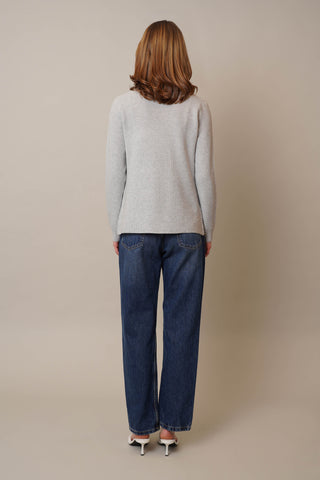 Model is wearing the Waffle Cardigan with Pockets by Cyrus in Grey Goose Heather