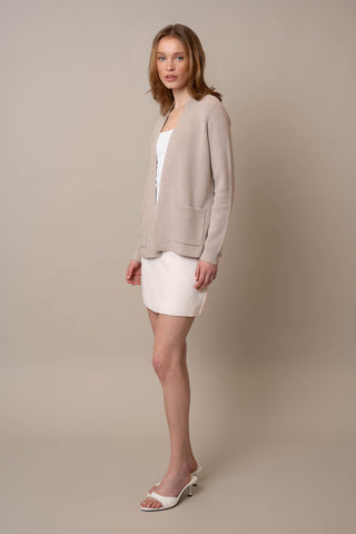Model is wearing the Waffle Cardigan with Pockets by Cyrus in Kitten Heather