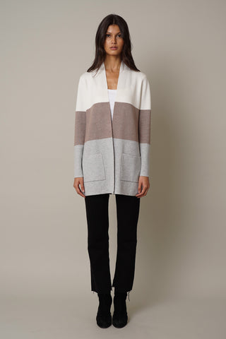 A woman with a versatile style wearing the Cyrus Color Block Open Cardigan.