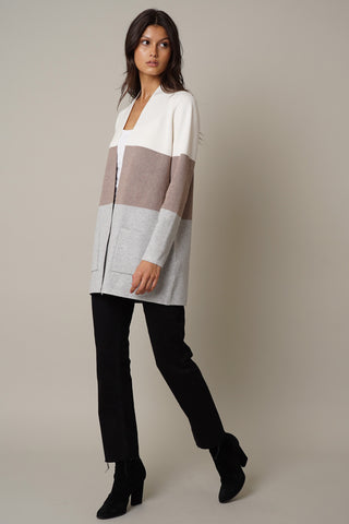 A woman showcasing a versatile style with the Cyrus Color Block Open Cardigan.