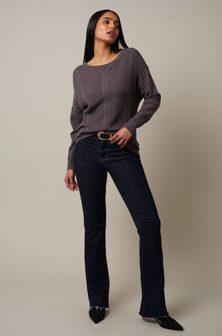 Model is wearing the Cable Knit Drop Shoulder Pullover in Grey Violet.