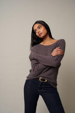 Model is wearing the Cable Knit Drop Shoulder Pullover in Grey Violet