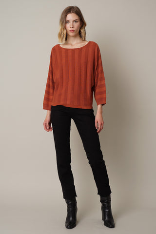 Pottery clay three fourths sleeve sweater with monochromatic stripes.