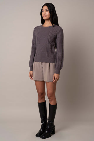 Model is wearing the wide-sleeve-cable-pullover in Grey Violet