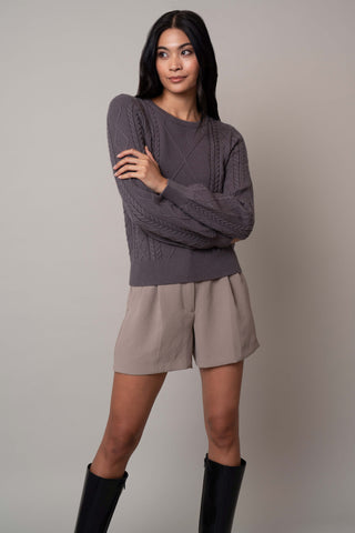 Model is wearing the wide-sleeve-cable-pullover in Grey Violet