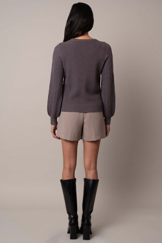 Model is wearing the wide-sleeve-cable-pullover in Grey Violet