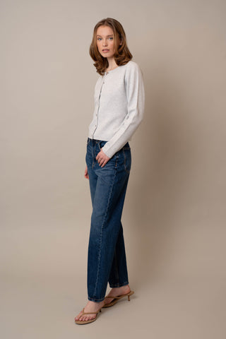 Model is wearing the Crew Neck Button Down Cardigan by Cyrus in Silver Heather Grey