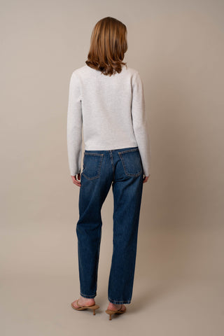 Model is wearing the Crew Neck Button Down Cardigan by Cyrus in Silver Heather Grey