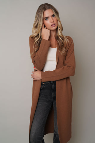 Model is wearing the Long Sleeve Dusterby Cyrus in Tobacco Brown