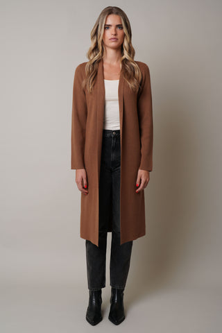 Model is wearing the by Cyrus in Tobacco Brown