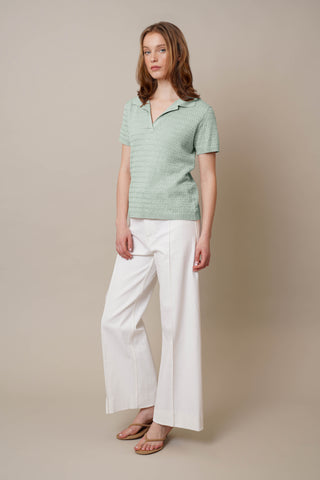 Model is wearing the Novelty Short Sleeve Pullover by Cyrus in Fresh Mint