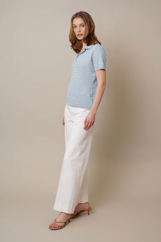 Model is wearing the Novelty Short Sleeve Pullover by Cyrus in Ice Sky