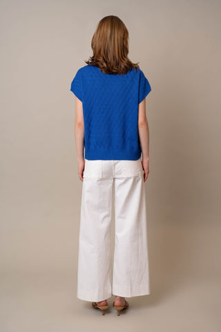 Model is wearing the Cable Crew Neck Pullover by Cyrus in Dazzling Blue