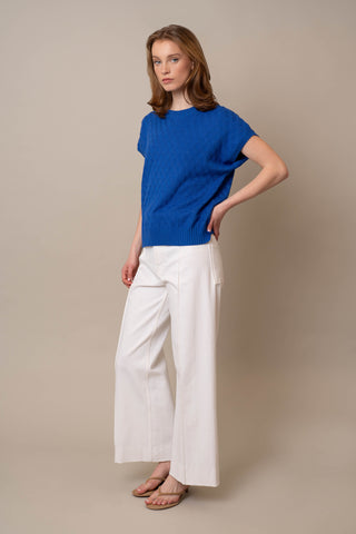 Model is wearing the Cable Crew Neck Pullover by Cyrus in Dazzling Blue