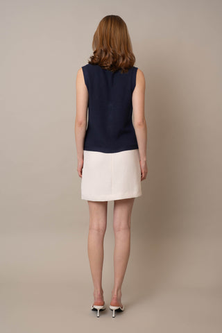 Model is wearing the Button Front V-Neck Vest by Cyrus in Eclipse