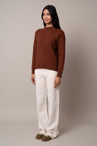 Model is wearing the mock-neck-pointelle-sweater in Havana Brown