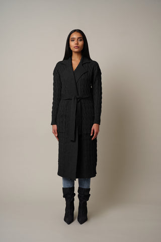 Model is wearing the Cable Knit Duster with Belt Tie in Black.