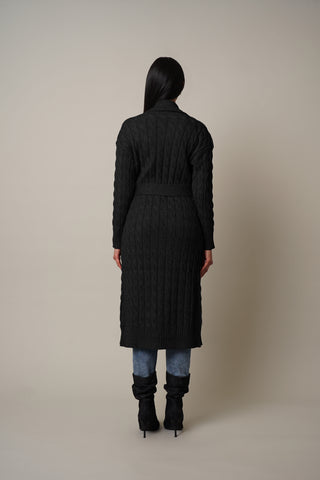 Model is wearing the Cable Knit Duster with Belt Tie in Black.